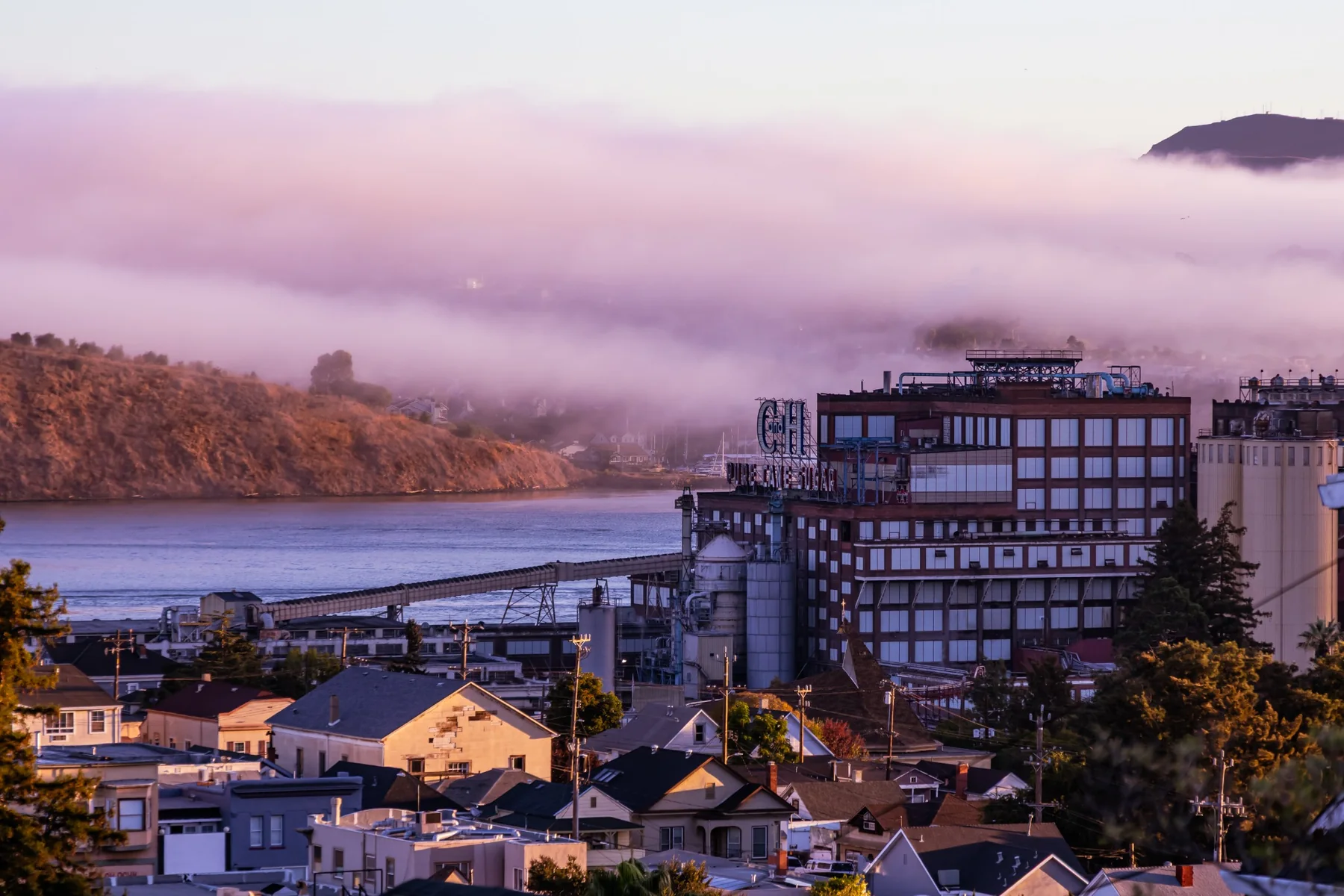 Historic sugar factory in Crockett beneath fog